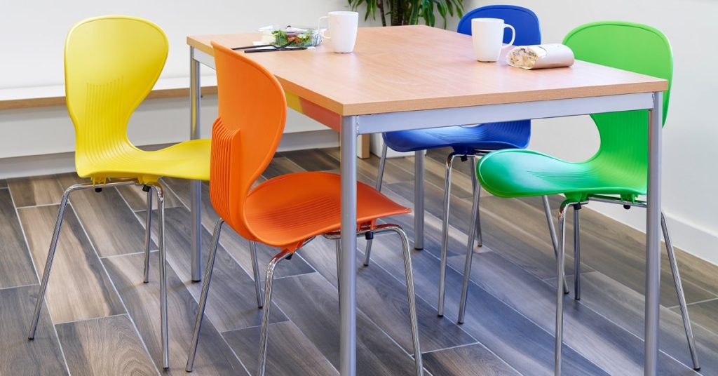 coloured chairs round a table
