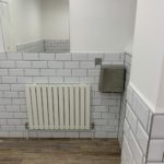 office washroom radiator and mirror