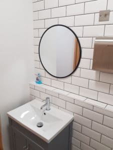 sink and circular mirror