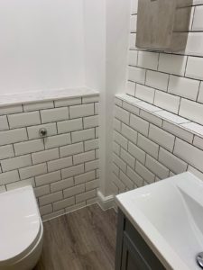 white tiling in washroom
