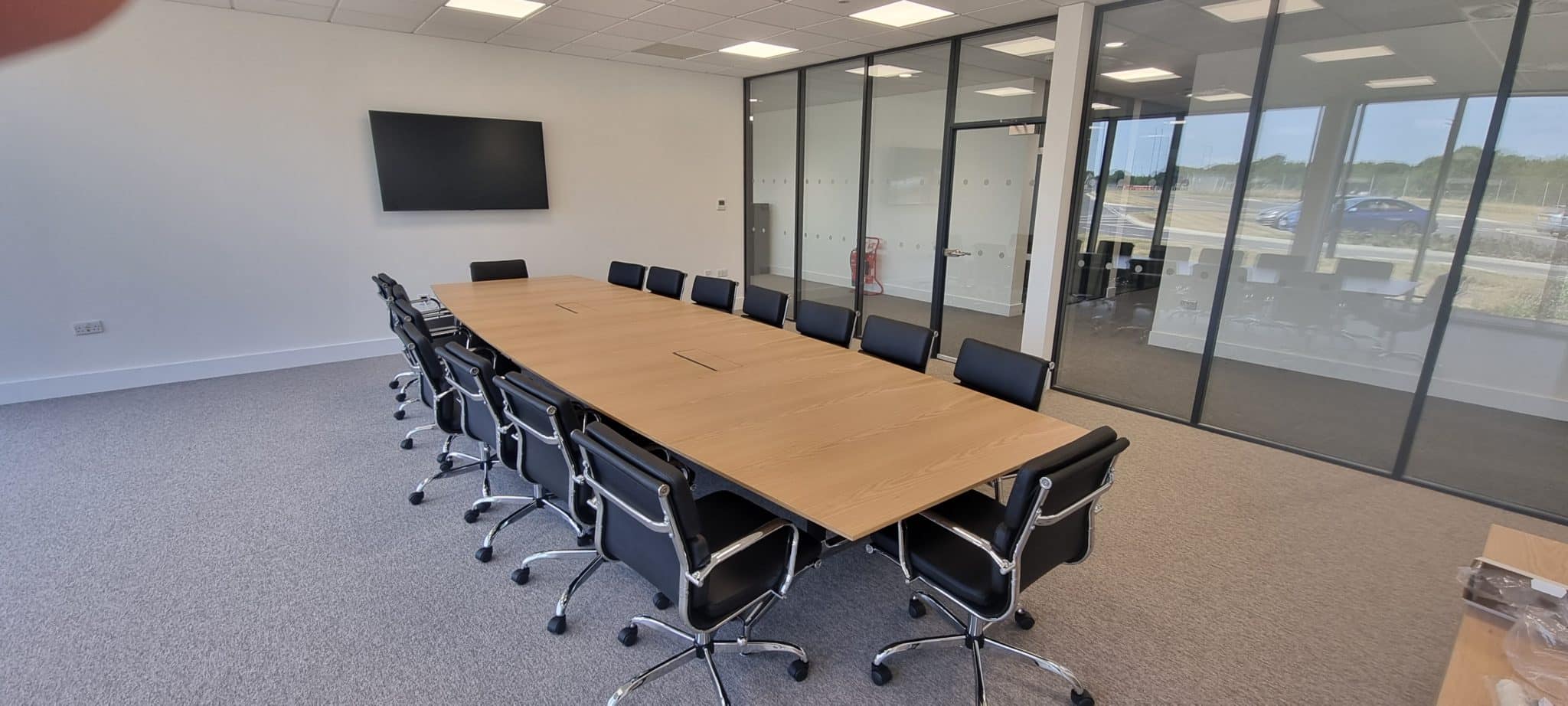5000 x 1500 Veneer Meeting table with integrated power and premium seating