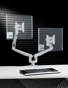 A monitor arm on an ergonomic desk from Pure Office Solutions